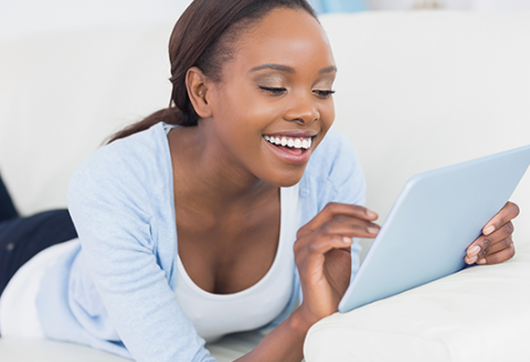 NTS e-shop solution woman using a tablet