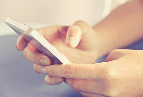 telco specific fraud cases Person using mobile phone