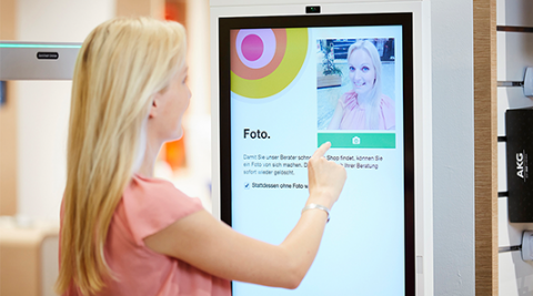 Self Service Queuing Solution Woman at Self Service Kiosk