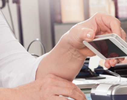 Woman paying with mobile phone