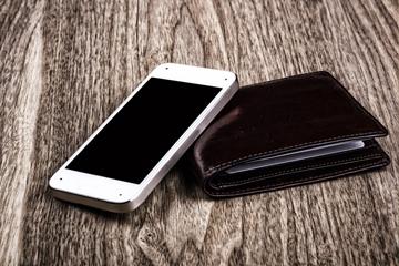 Mobile phone and black leather wallet Mobile phone and black leather wallet image small
